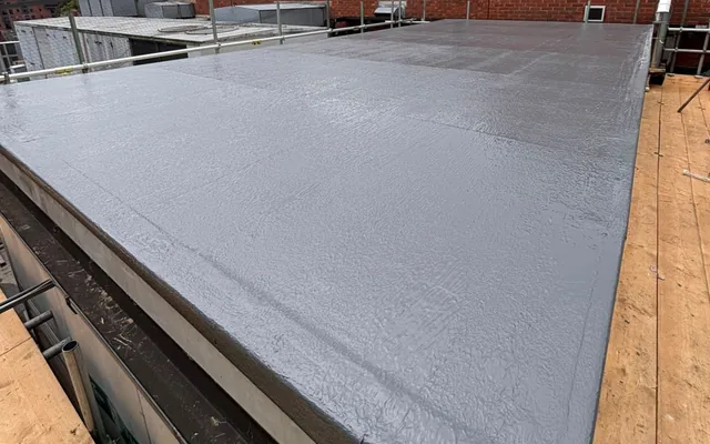 Liquid-waterproofed plant-room roof with scaffold platforms alongside in Chester